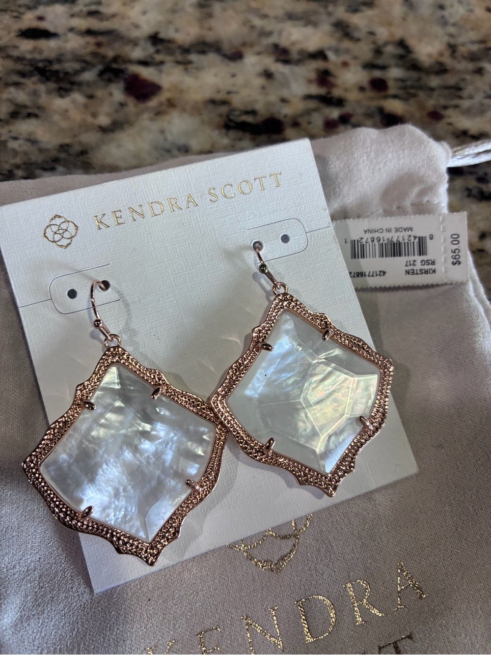 Nwt Kendra Scott Rosegold Kirsten earrings in mother of pearl.